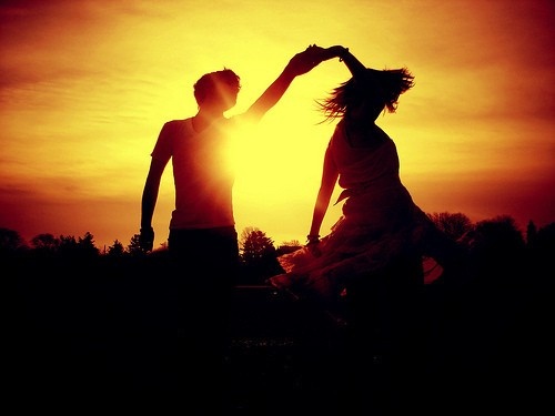 dancing couple sunset