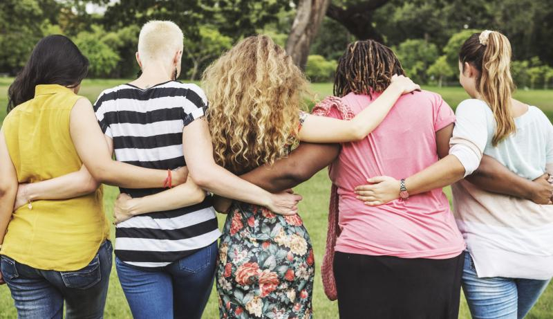 group people arm in arm